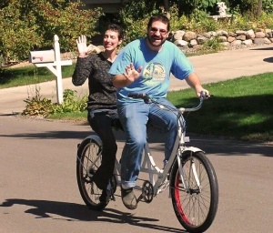 David's brother Will bought this tandem bike shortly after intense cancer treatment so that Brenda could enjoy the thrill of bike riding without having to do any work -- other than hang on while David maneuvers his way around town.